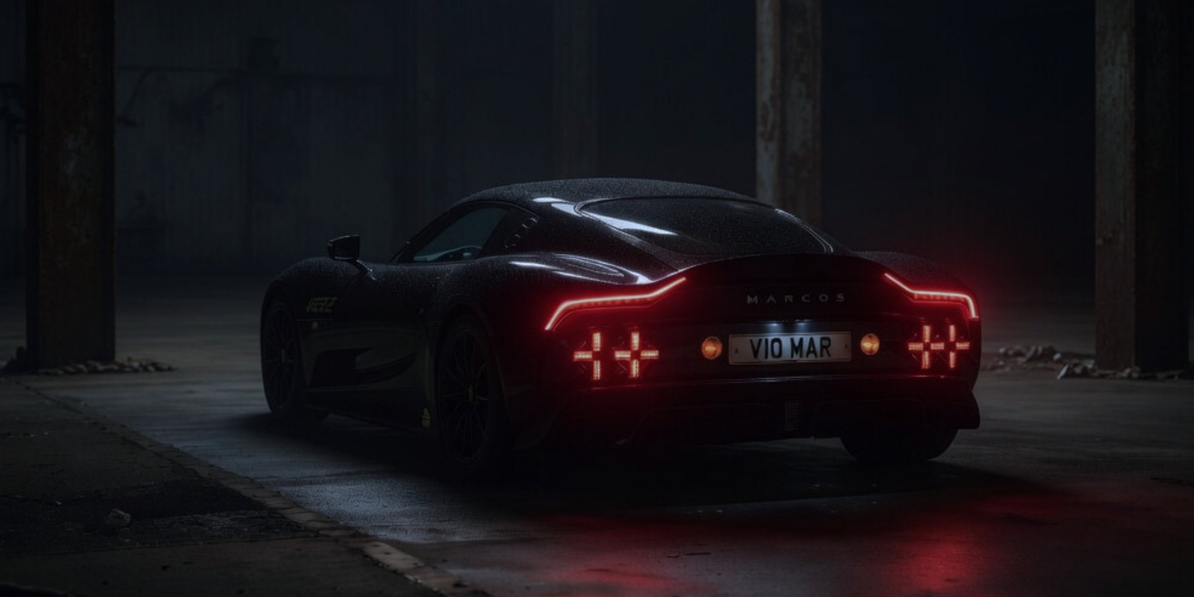 The Marcos Manticore prototype, photographed three-quarter rear in a dim studio